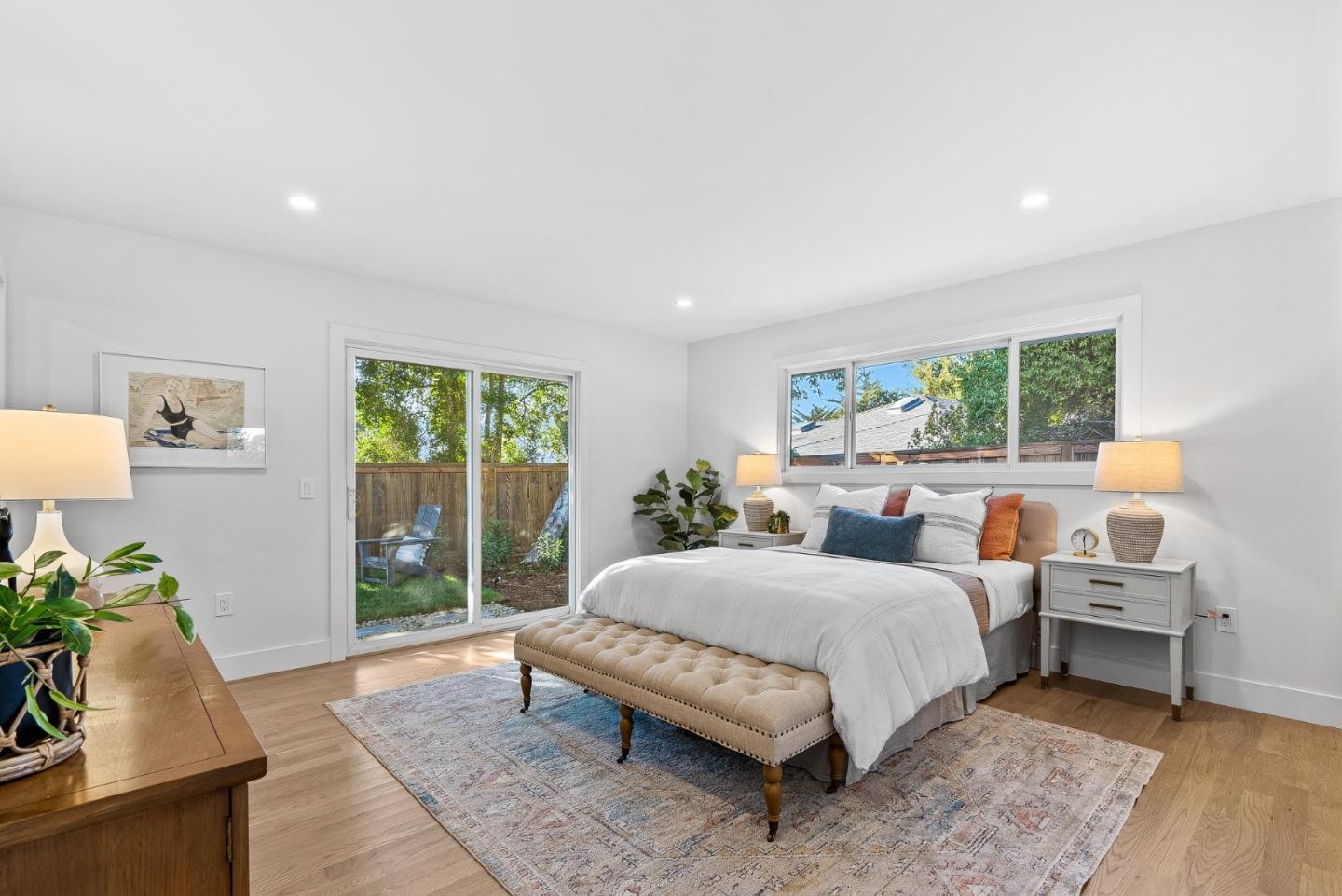 880 Pinehurst Drive Aptos, CA 95003 - Photo 18 of 25 a spacious bedroom with a bed and a window