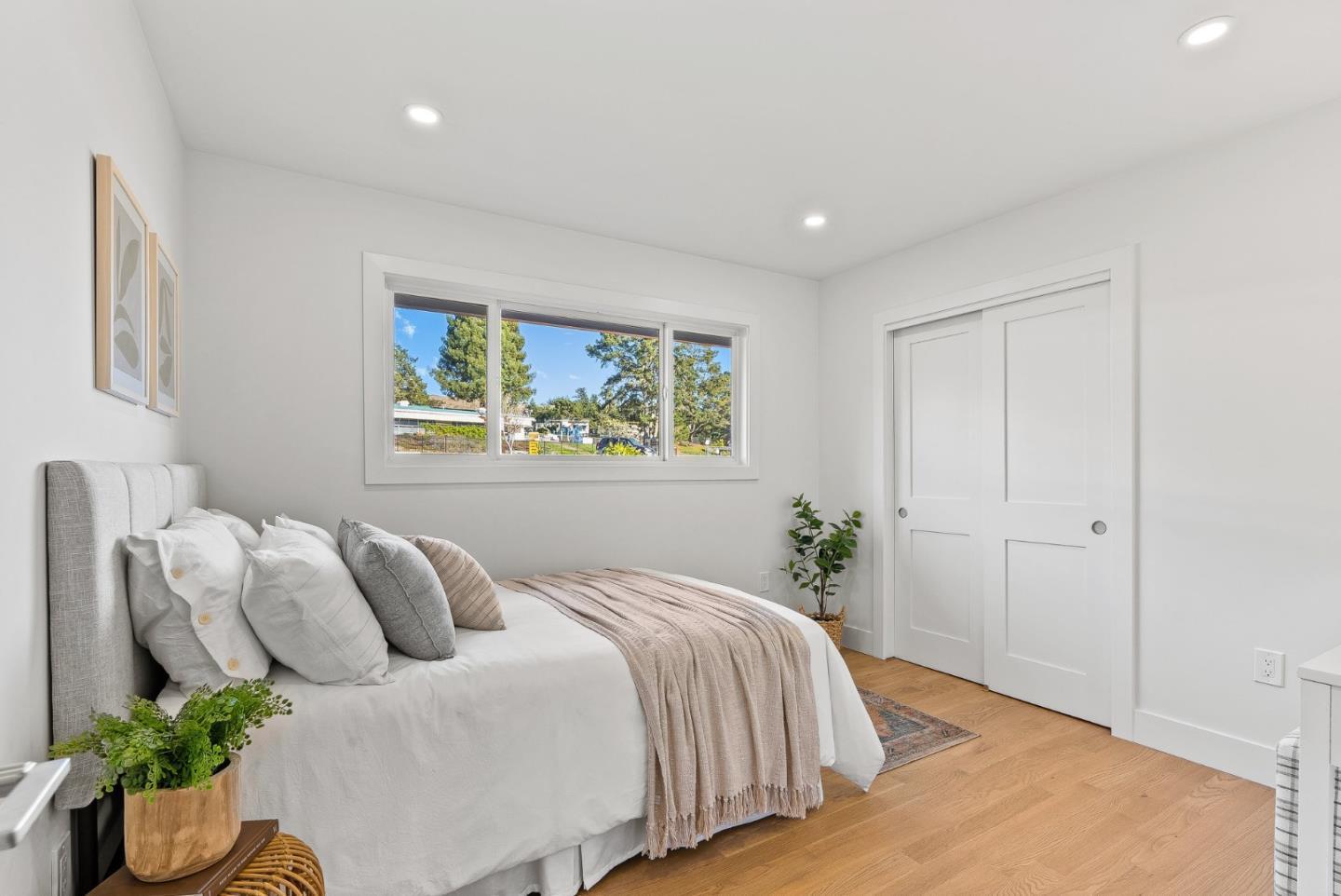 880 Pinehurst Drive Aptos, CA 95003 - Photo 19 of 25 a bedroom with a bed and painting on the wall