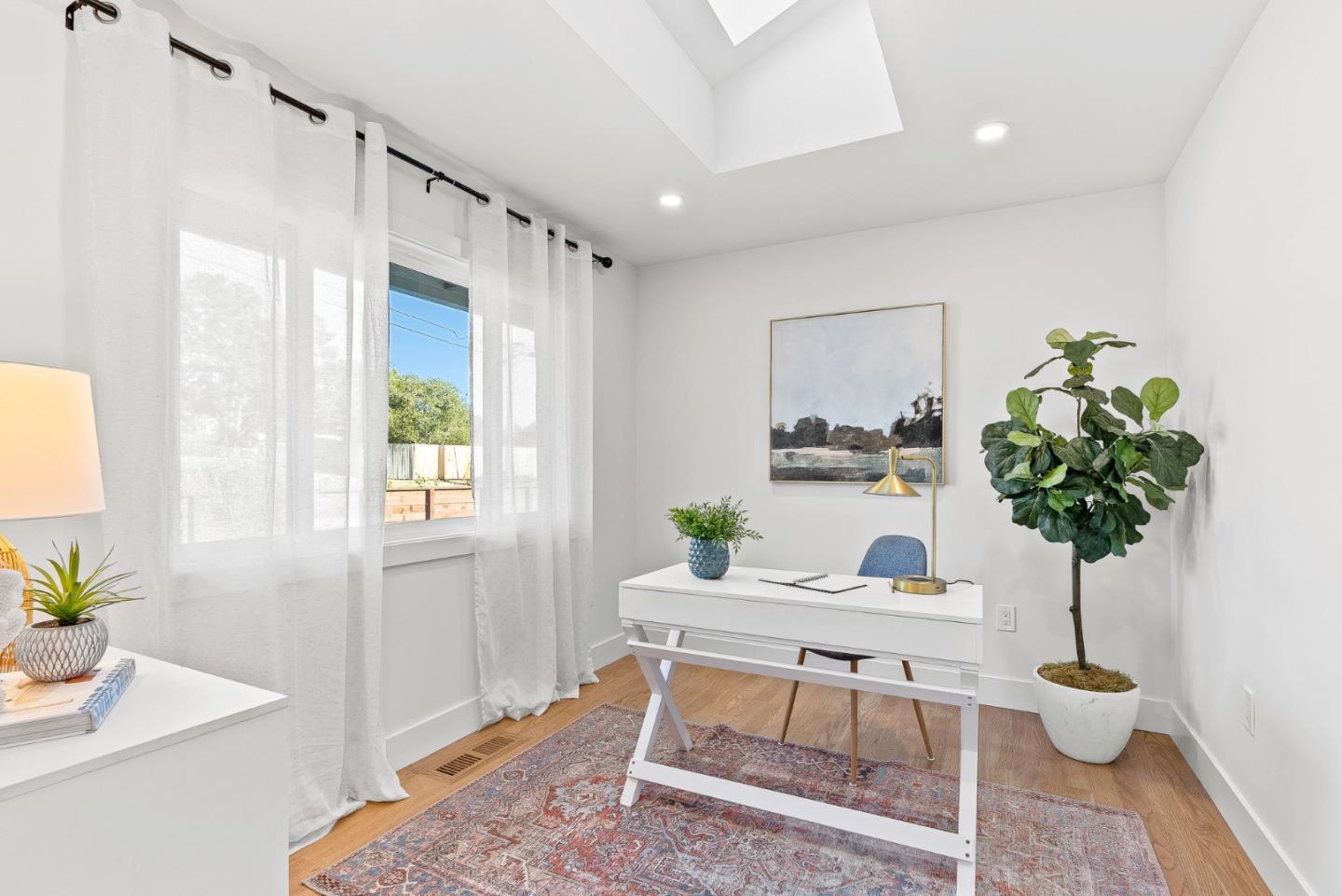 880 Pinehurst Drive Aptos, CA 95003 - Photo 22 of 25 a living room with furniture and a potted plant