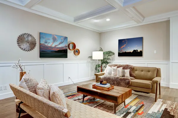 a living room with furniture and a rug