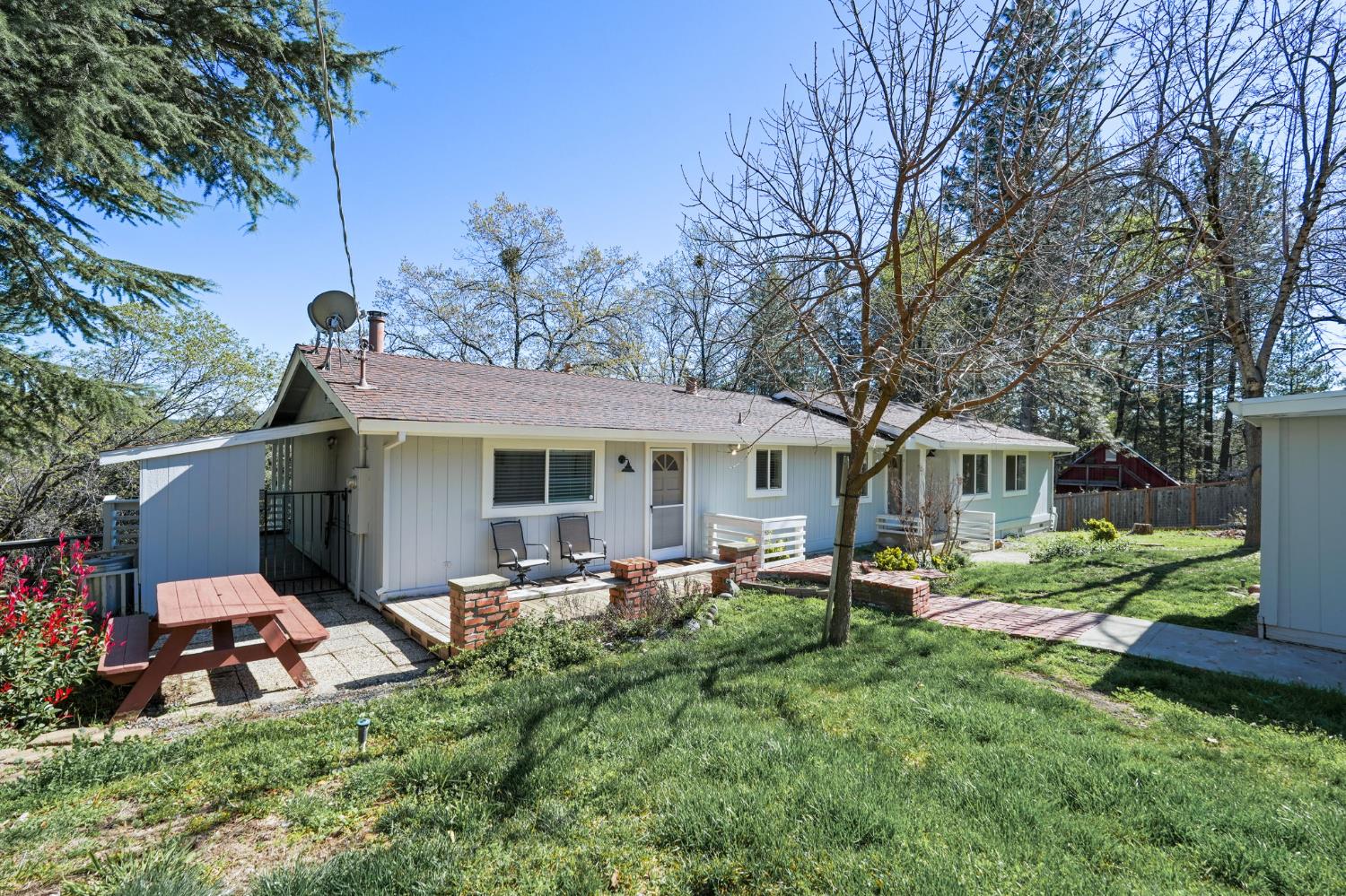24980 North Canyon Way Colfax, CA 95713 - Photo 1 of 30 a view of a house with backyard sitting area and garden