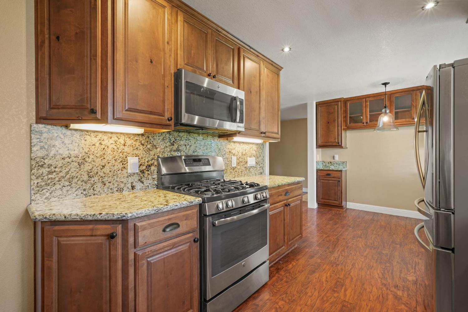 24980 North Canyon Way Colfax, CA 95713 - Photo 11 of 30 a kitchen with a sink stove and refrigerator