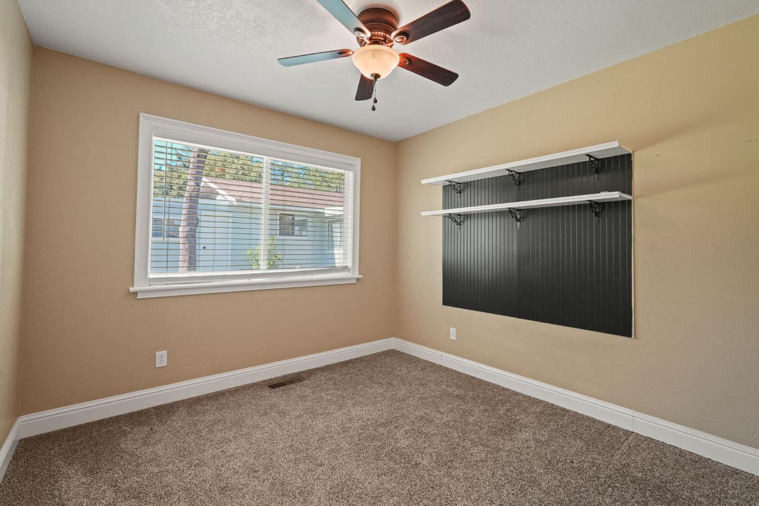 24980 North Canyon Way Colfax, CA 95713 - Photo 17 of 30 a view of an empty room with window and a ceiling fan