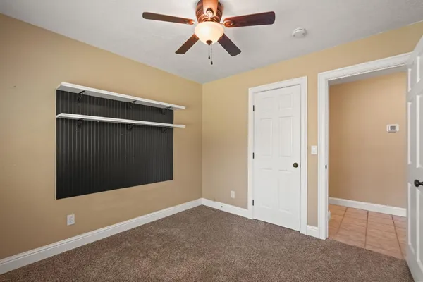 a bathroom with a granite countertop sink mirror toilet and bathtub