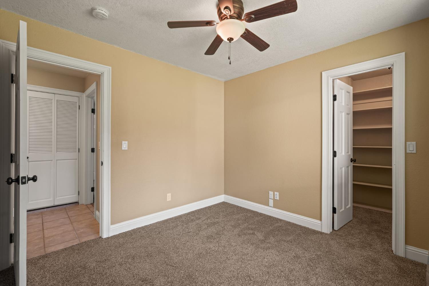 24980 North Canyon Way Colfax, CA 95713 - Photo 21 of 30 a view of empty room with a ceiling fan