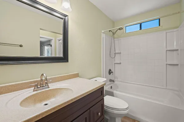 a view of a balcony with chairs and wooden floor