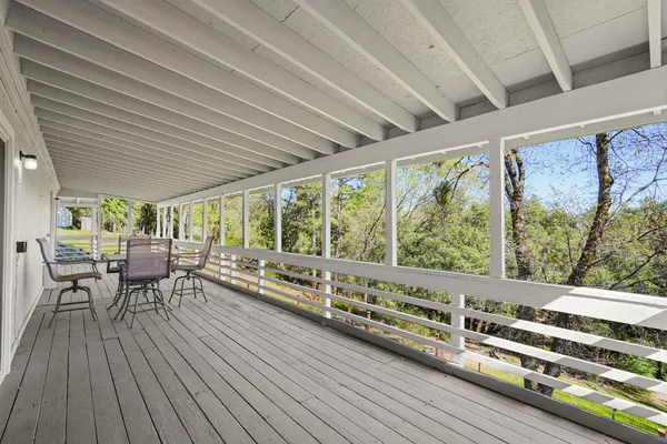 a view of a balcony with chairs