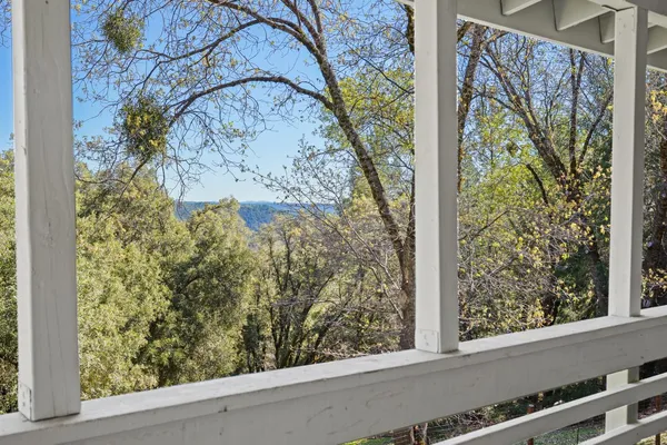 a front view of a house with a yard table and chairs