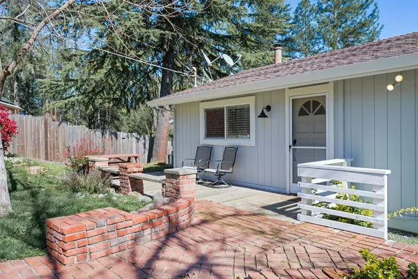 a backyard of a house with outdoor seating