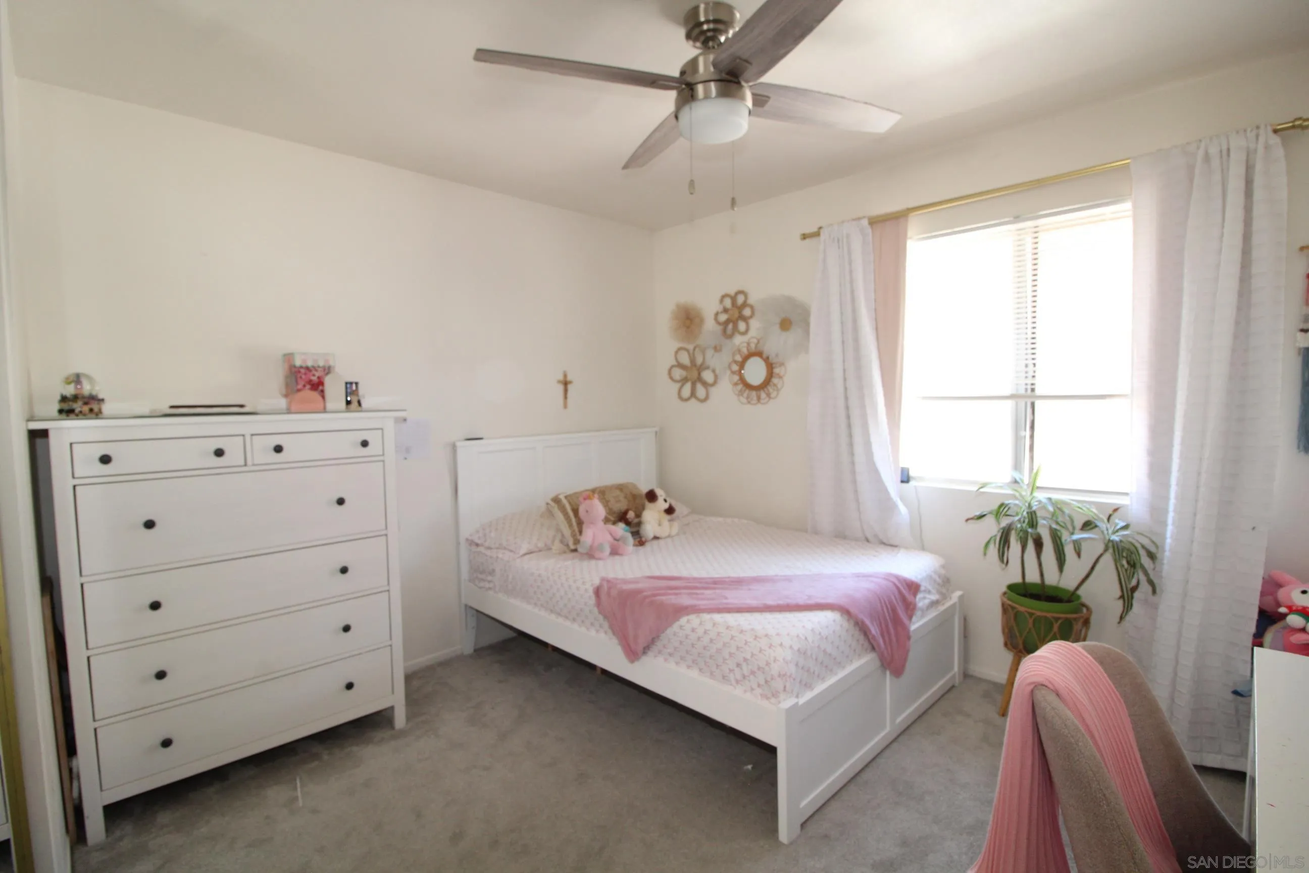 783 Timber Cove Way Oceanside, CA 92058 - Photo 17 of 28 a bedroom with a bed and a window