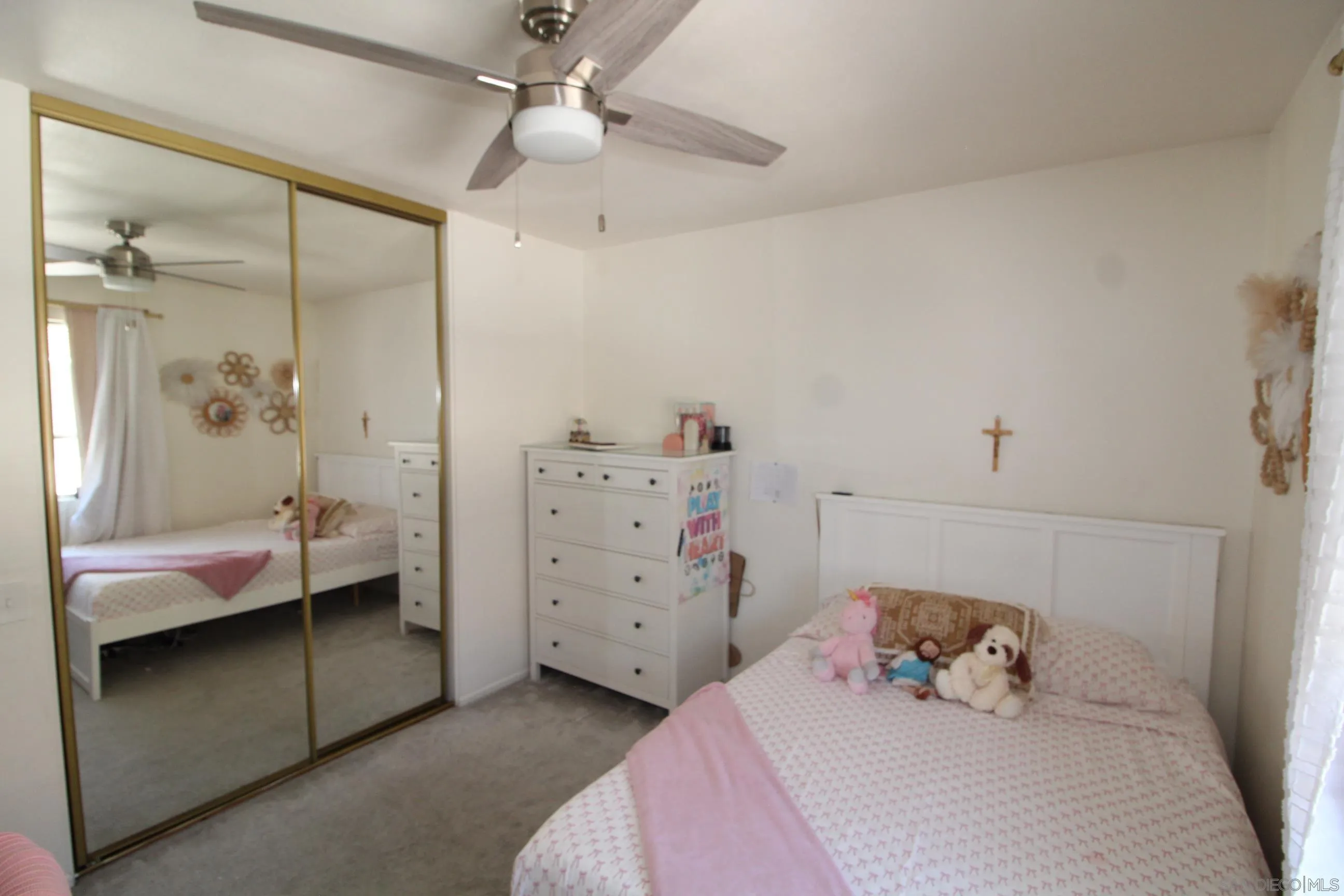 783 Timber Cove Way Oceanside, CA 92058 - Photo 18 of 28 a bedroom with a bed and a window