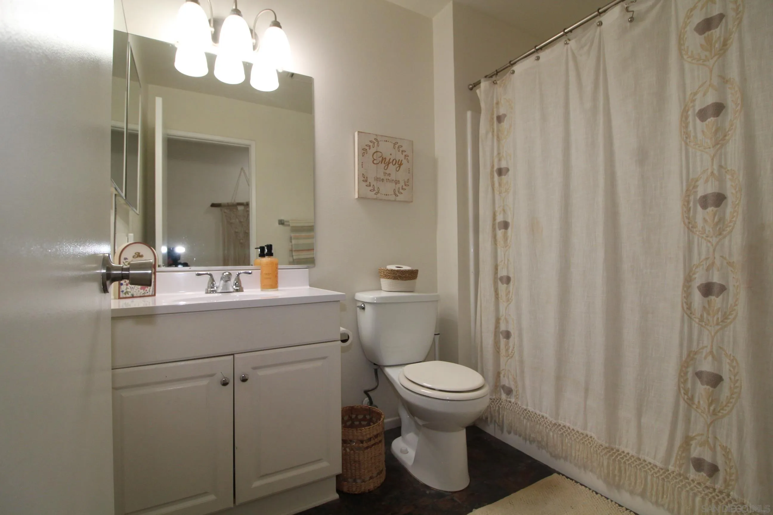 783 Timber Cove Way Oceanside, CA 92058 - Photo 19 of 28 a bathroom with a sink a toilet and shower
