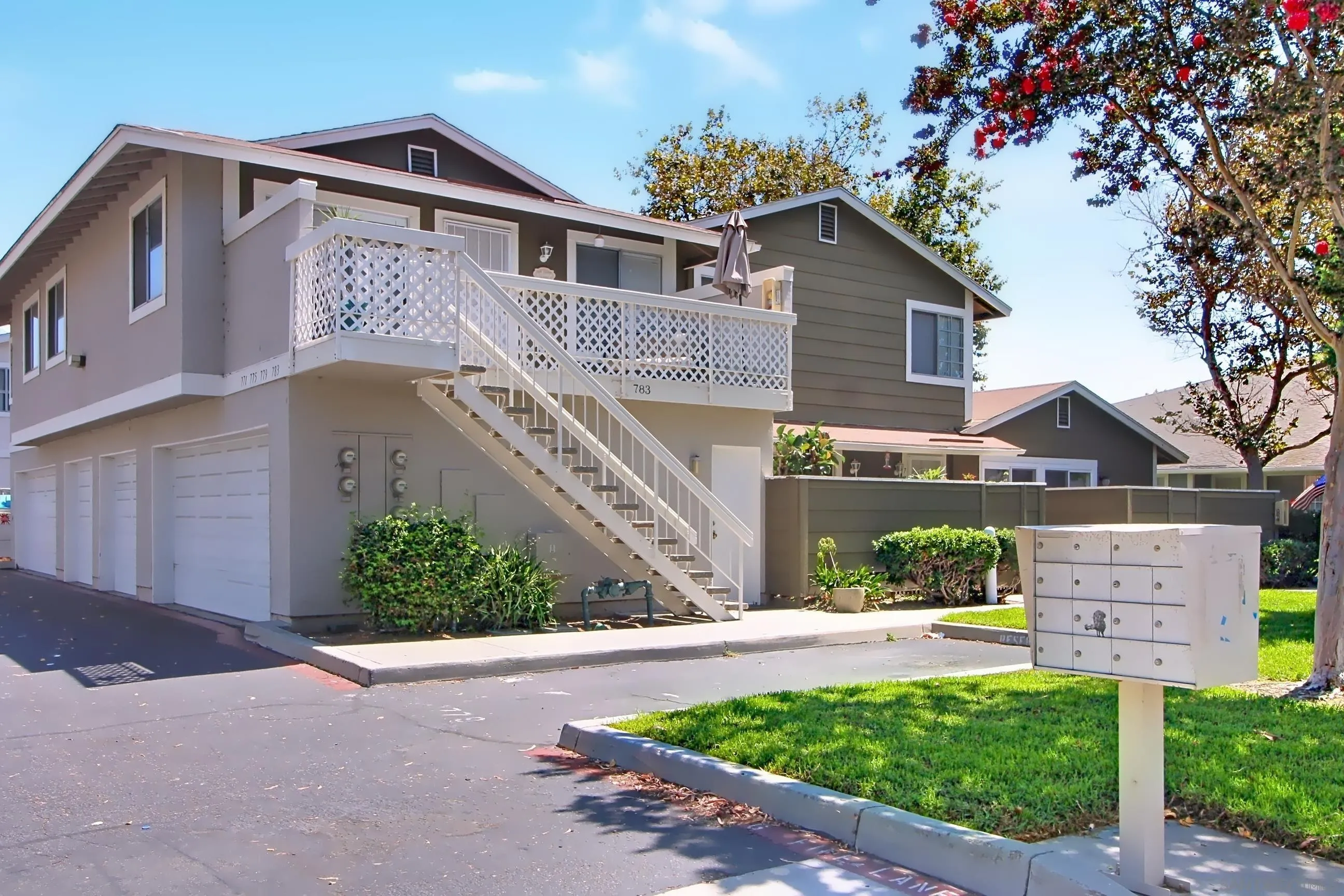 783 Timber Cove Way Oceanside, CA 92058 - Photo 2 of 28 a front view of a house with a yard and potted plants