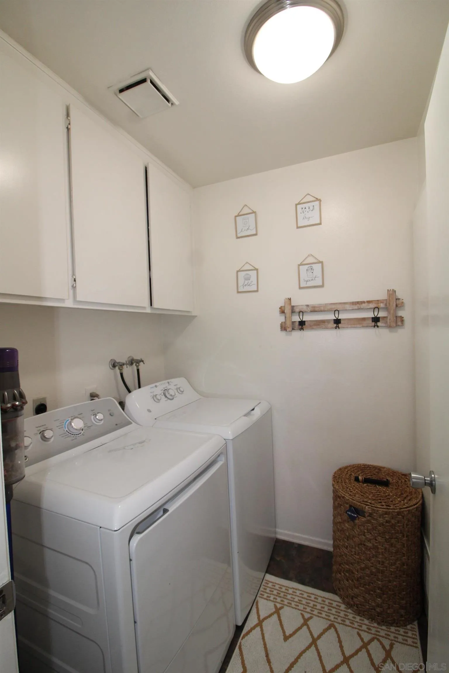 783 Timber Cove Way Oceanside, CA 92058 - Photo 21 of 28 a utility room with dryer and washer