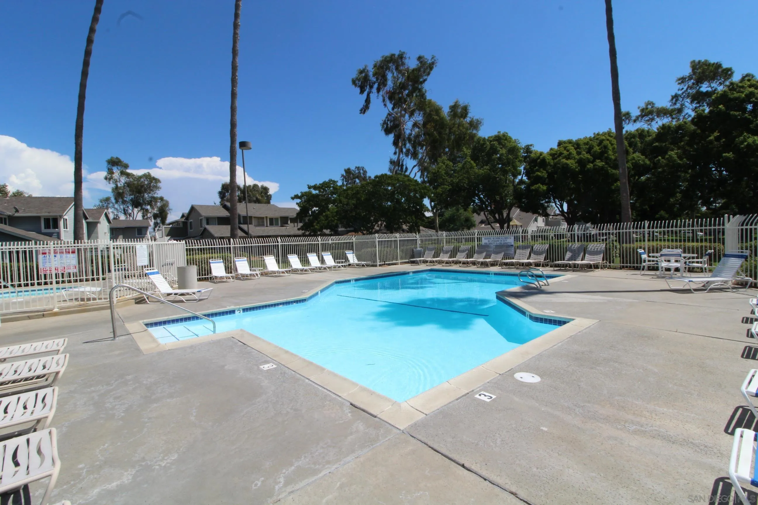 783 Timber Cove Way Oceanside, CA 92058 - Photo 23 of 28 a view of a swimming pool with a bench