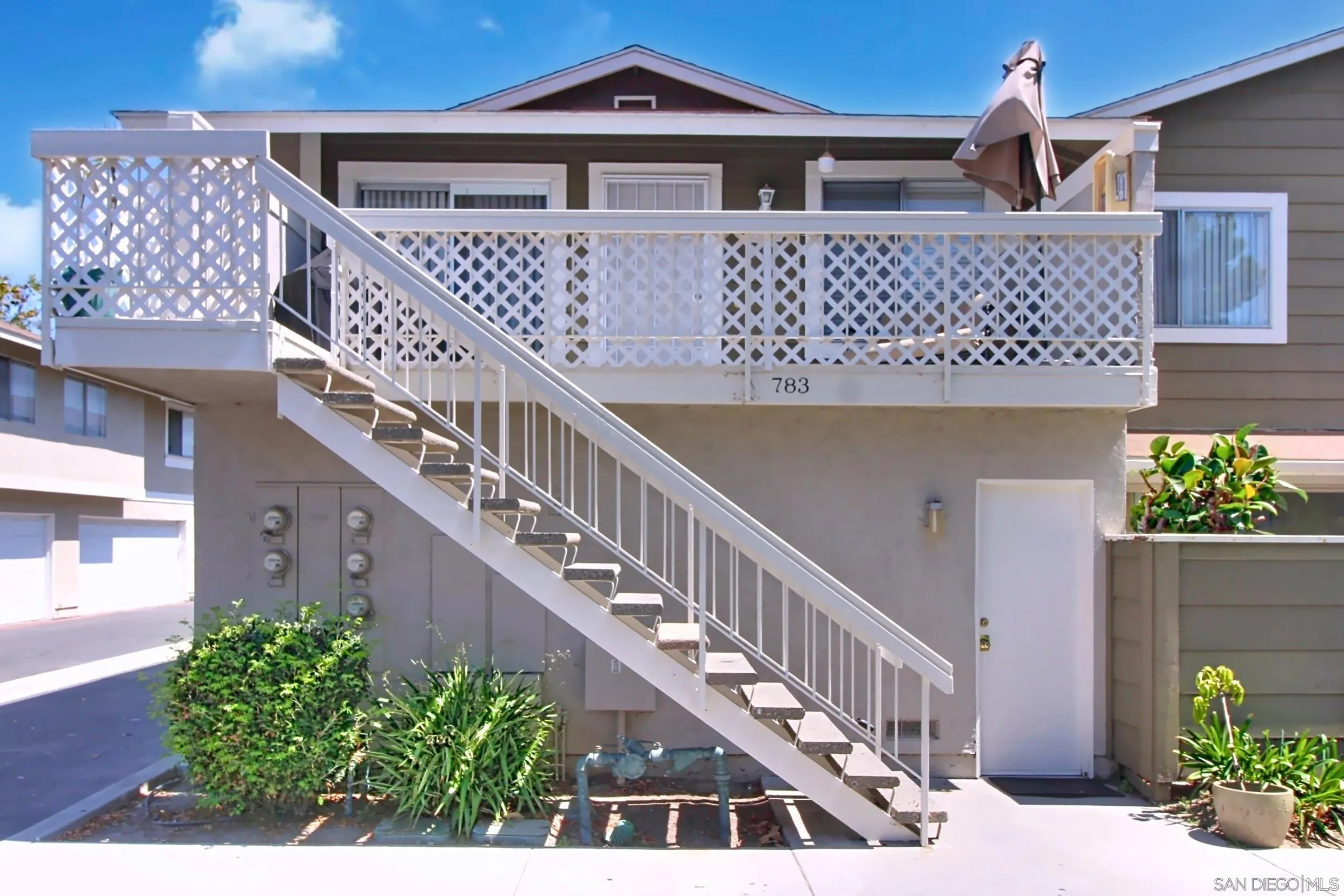 783 Timber Cove Way Oceanside, CA 92058 - Photo 3 of 28 a front view of a house with a yard
