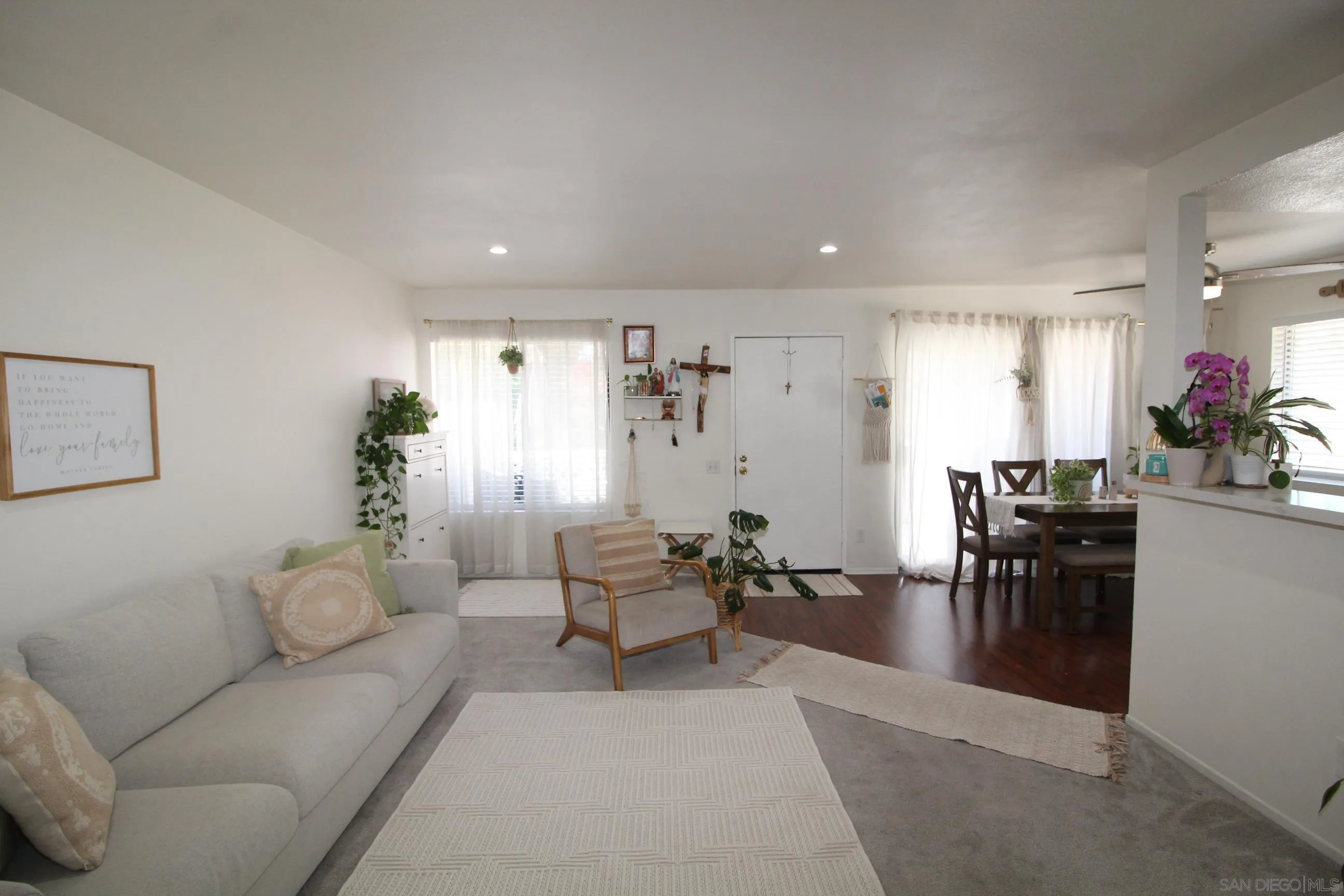 783 Timber Cove Way Oceanside, CA 92058 - Photo 6 of 28 a living room with furniture and a dining table with potted plant