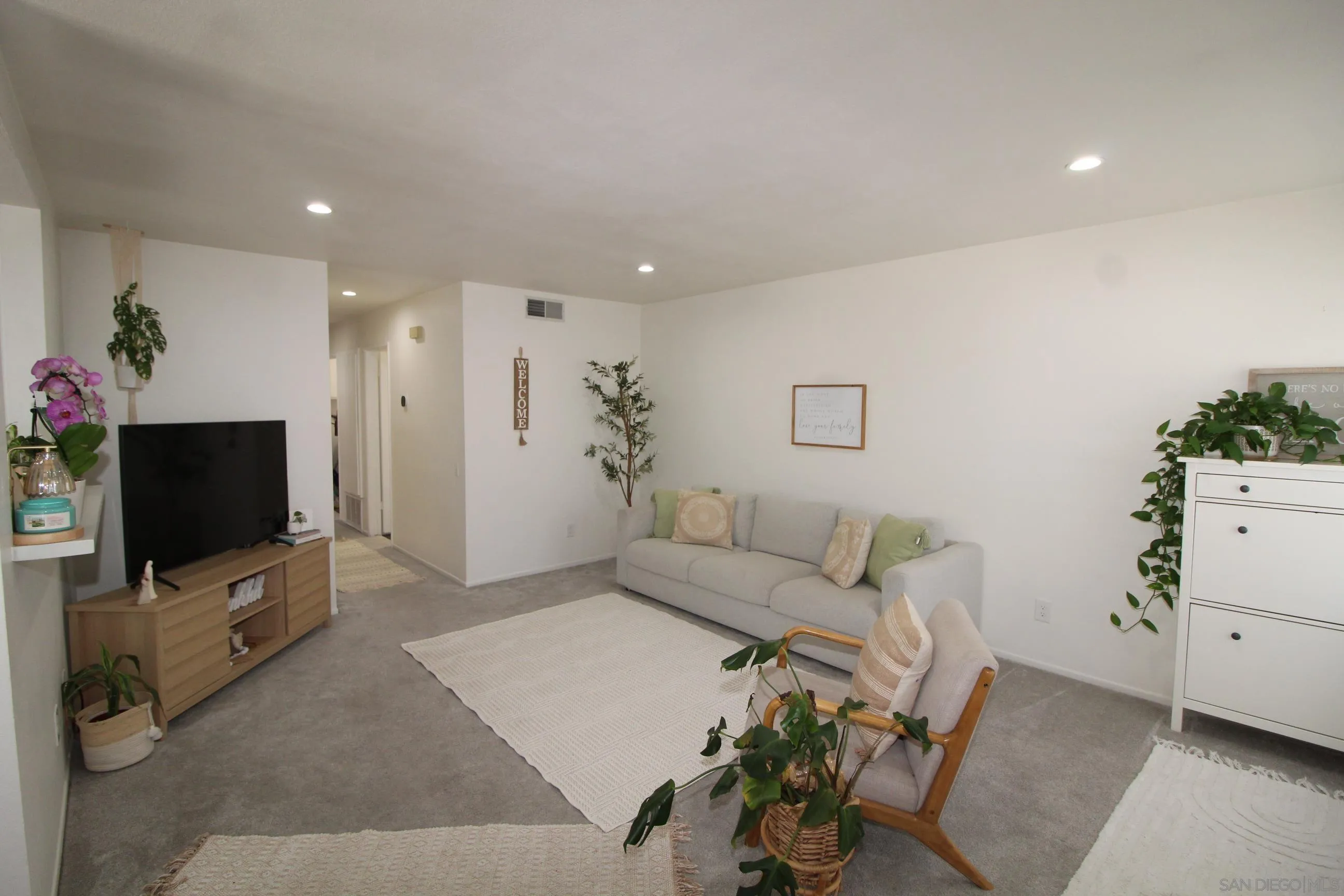 783 Timber Cove Way Oceanside, CA 92058 - Photo 7 of 28 a living room with furniture and a flat screen tv
