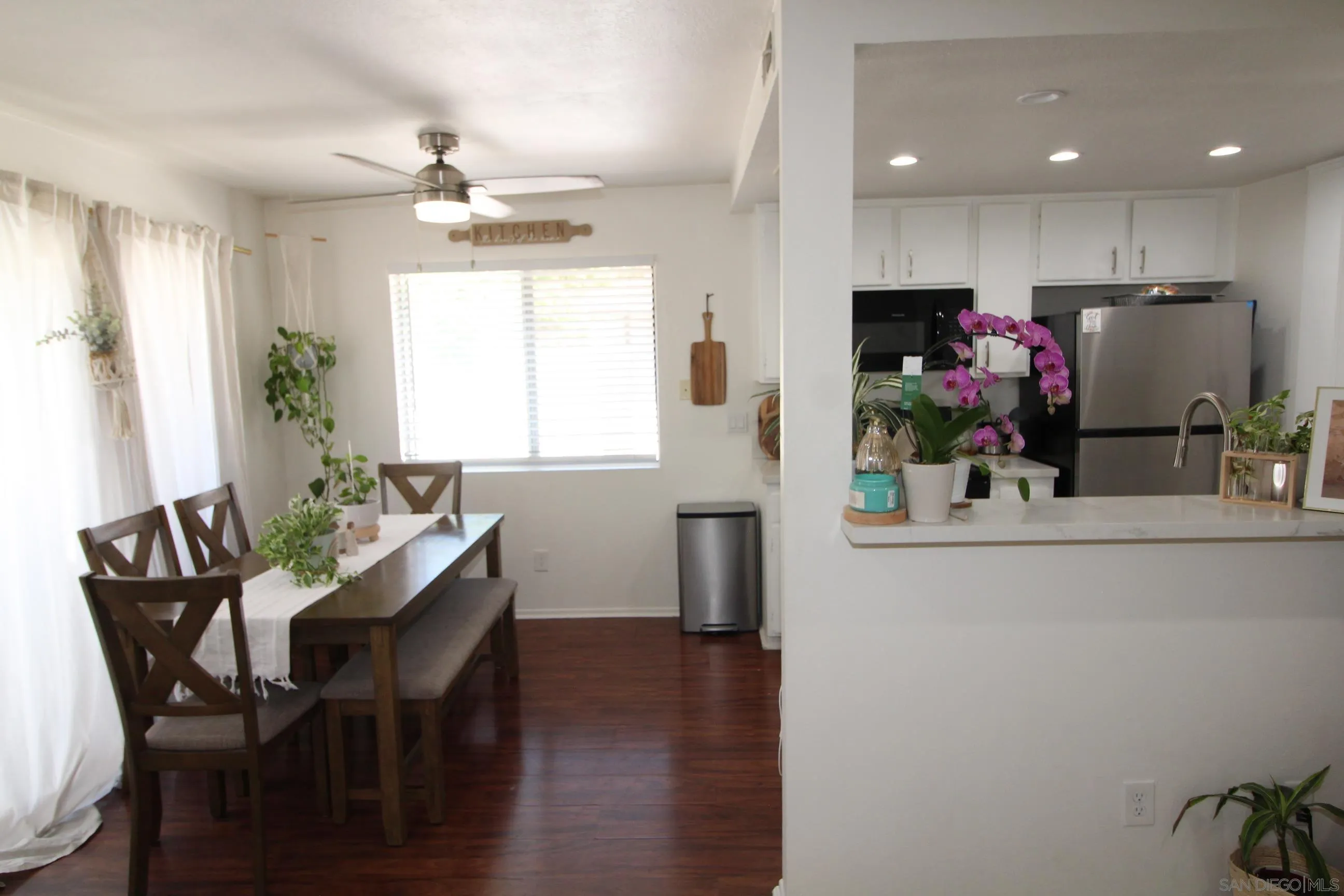 783 Timber Cove Way Oceanside, CA 92058 - Photo 8 of 28 a kitchen with a table and chairs in it