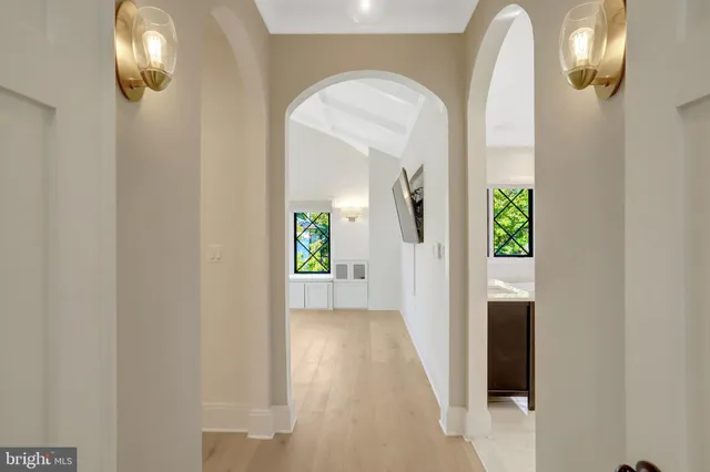 a bedroom with a bed and a dresser in it