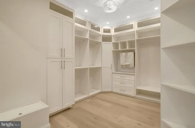 a view of a livingroom with wooden floor and a flat screen tv