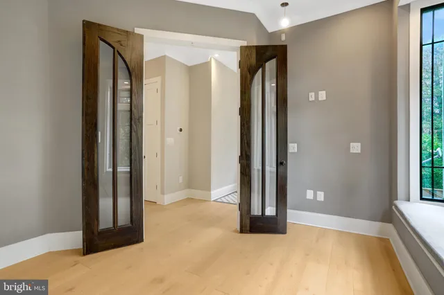 a large kitchen with kitchen island a sink stainless steel appliances and a counter top space