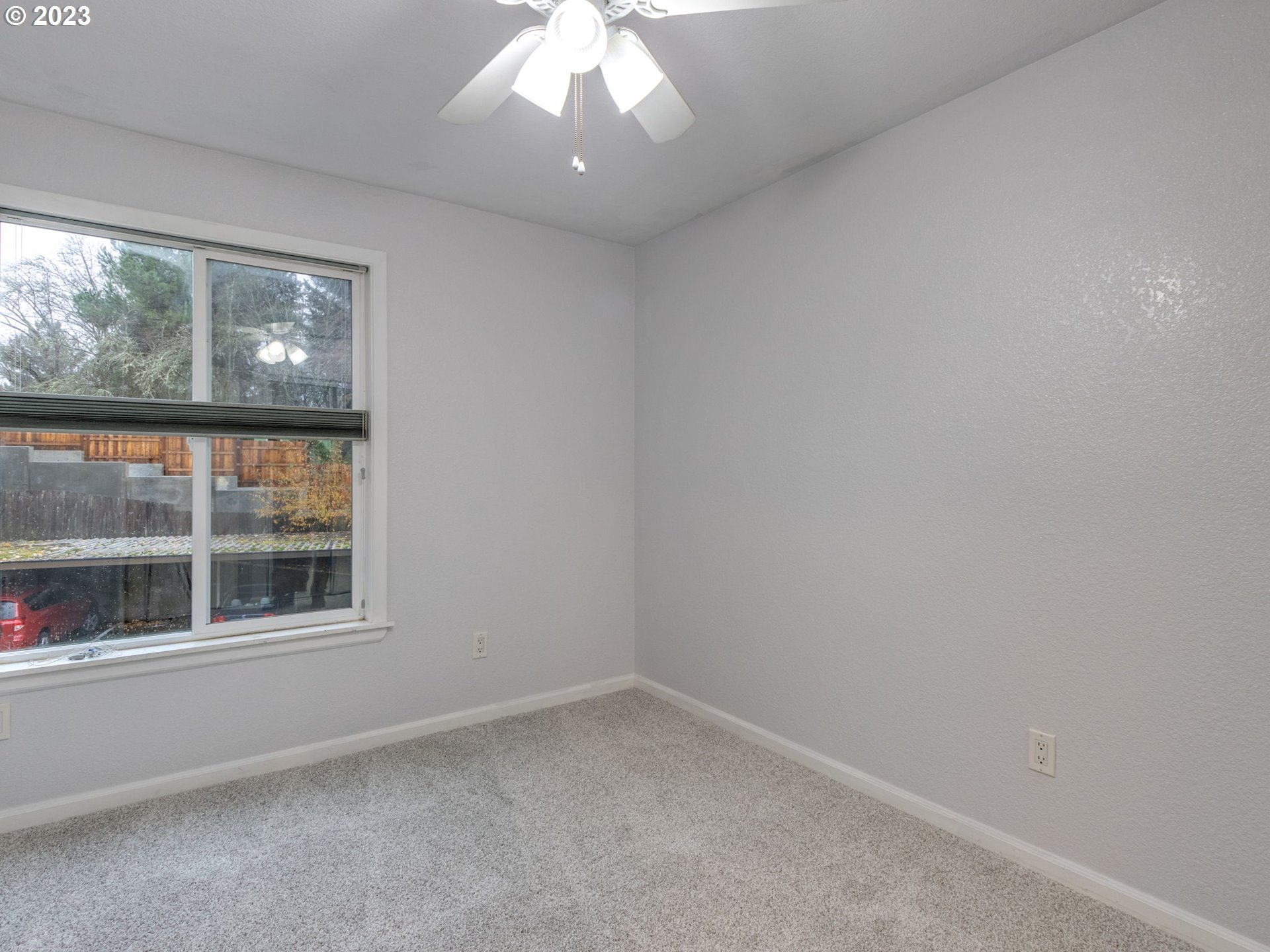 7937 Southwest 40th Avenue, Unit F Portland, OR 97219 - Photo 14 of 36 an empty room with a window