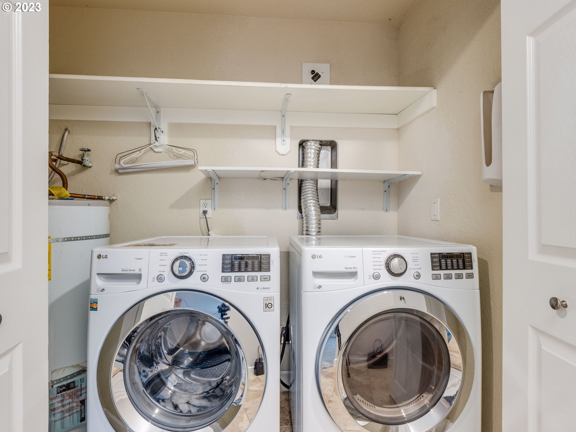7937 Southwest 40th Avenue, Unit F Portland, OR 97219 - Photo 22 of 36 a utility room with dryer and washer