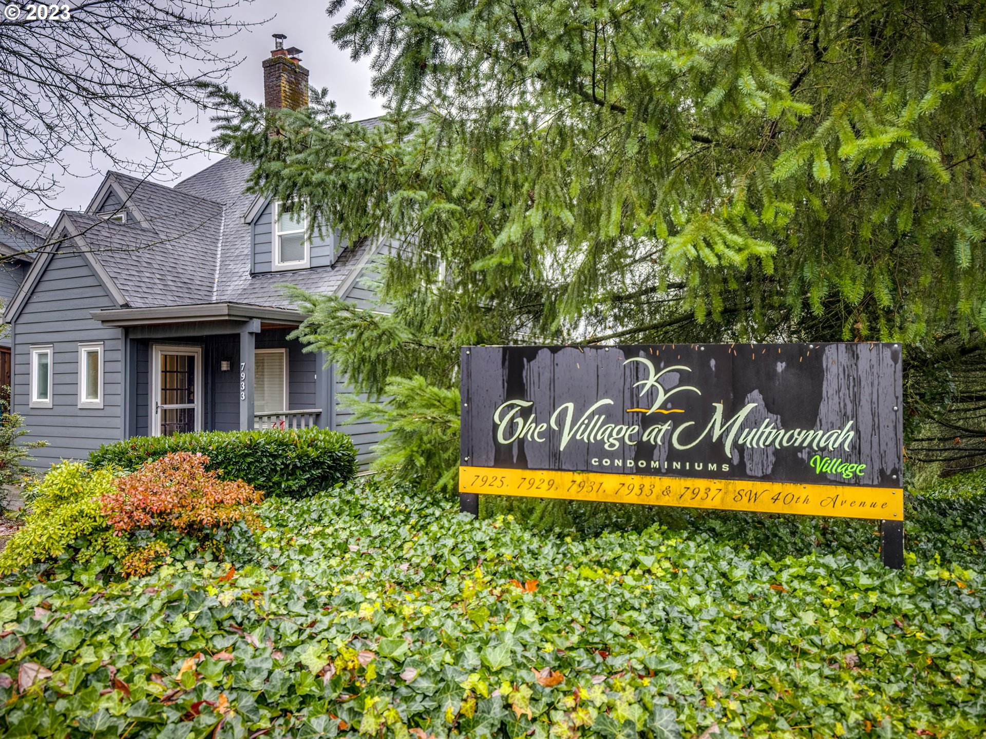 7937 Southwest 40th Avenue, Unit F Portland, OR 97219 - Photo 28 of 36 a view of a house with a yard and sitting area