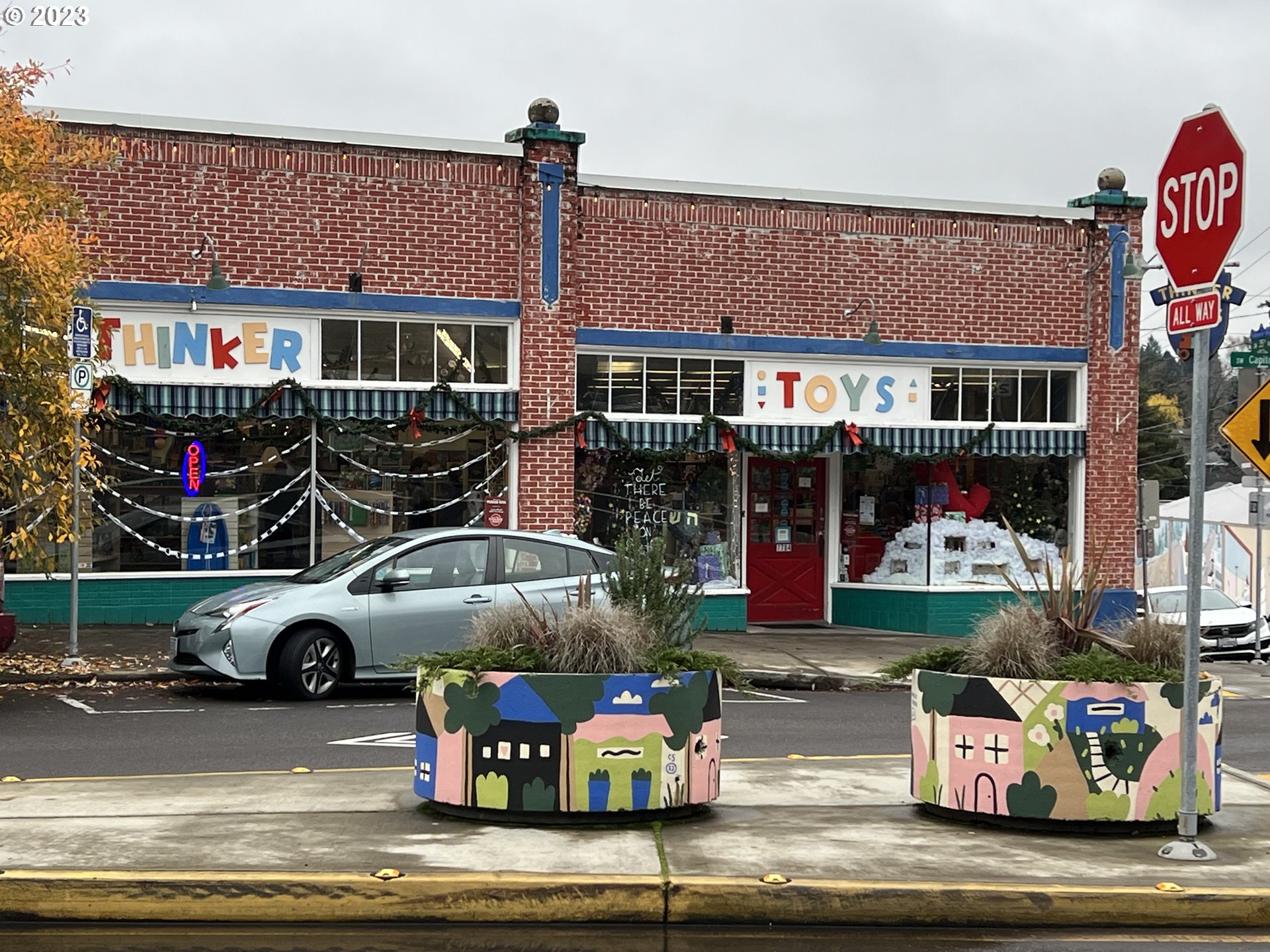 7937 Southwest 40th Avenue, Unit F Portland, OR 97219 - Photo 30 of 36 a front view of a house with car parked