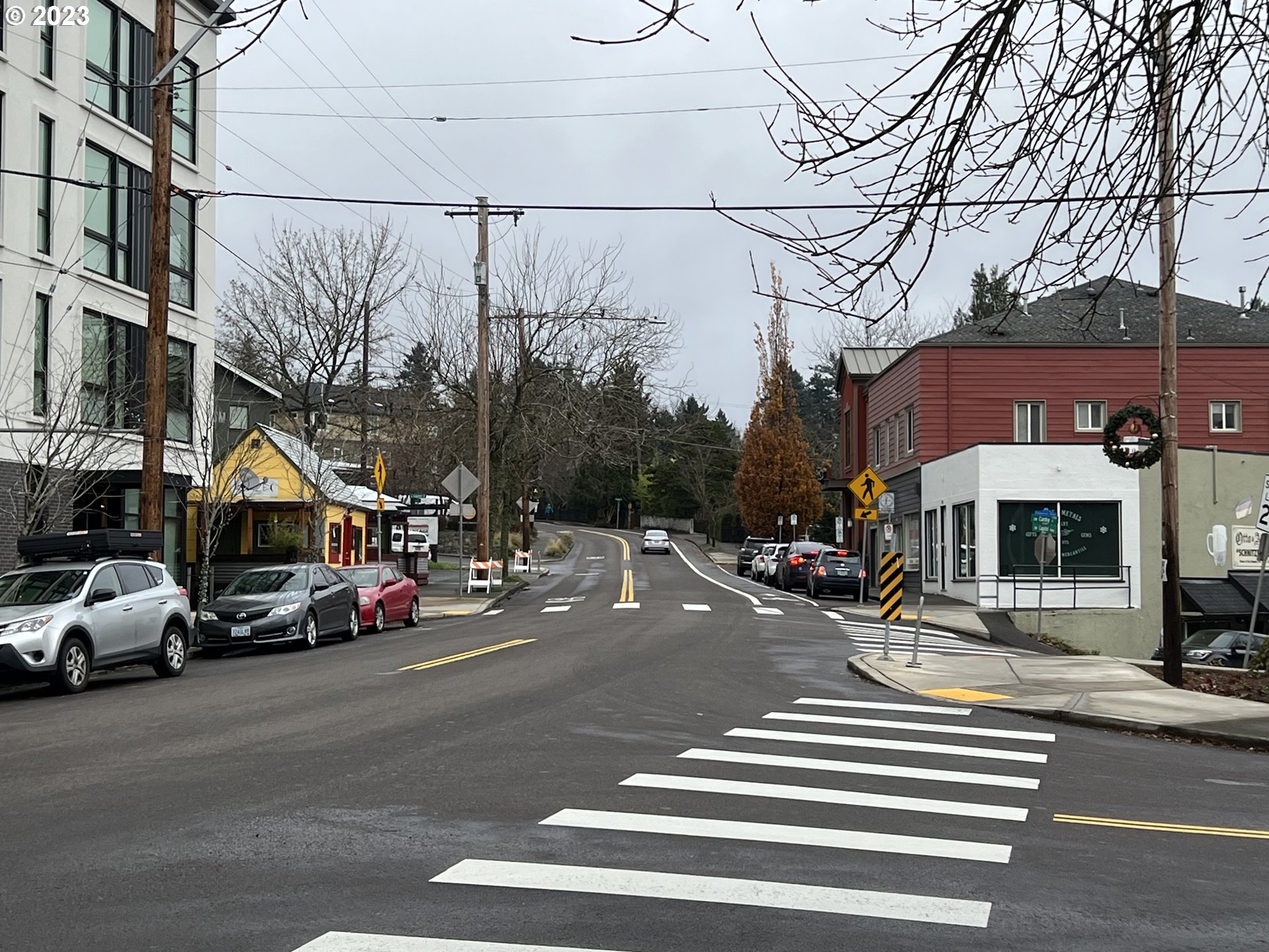 7937 Southwest 40th Avenue, Unit F Portland, OR 97219 - Photo 36 of 36 a view of a city street with cars