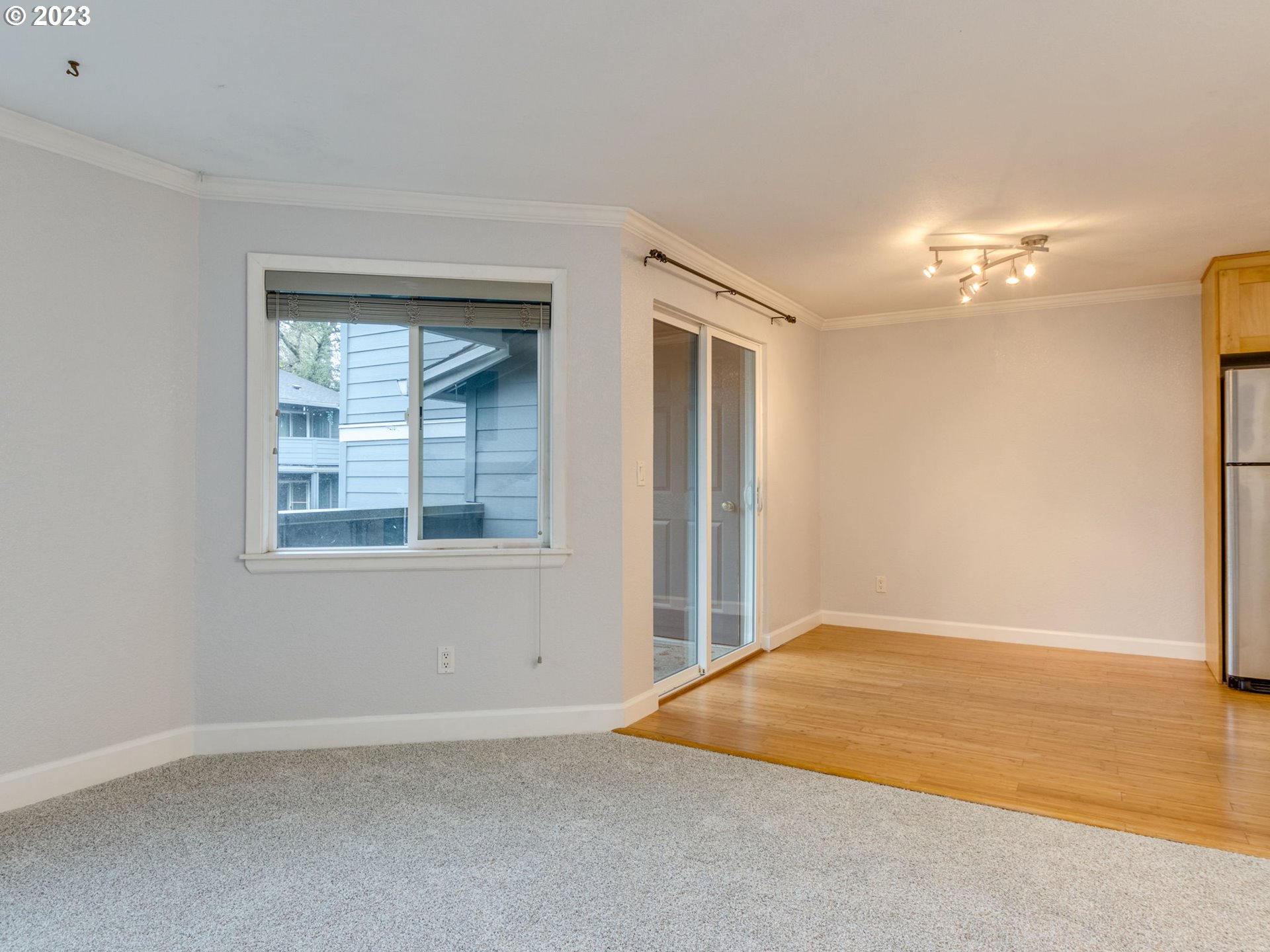 7937 Southwest 40th Avenue, Unit F Portland, OR 97219 - Photo 6 of 36 a view of an empty room with a window
