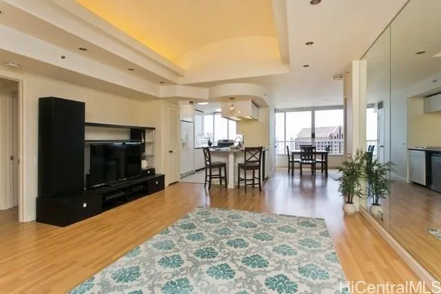 a living room with furniture and a flat screen tv