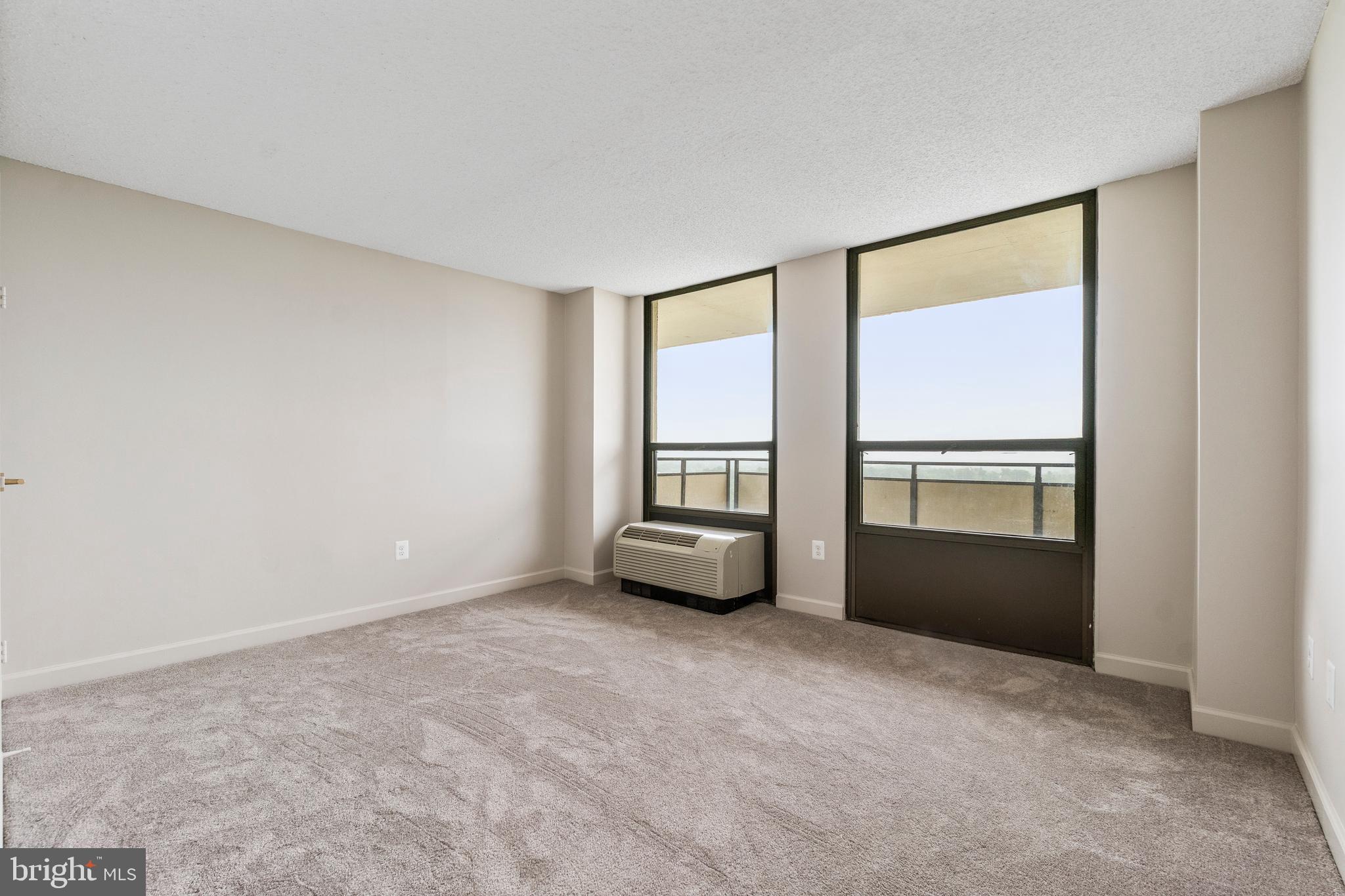 205 East Joppa Road, Unit 2703 Towson, MD 21286 - Photo 26 of 34 an empty room with windows