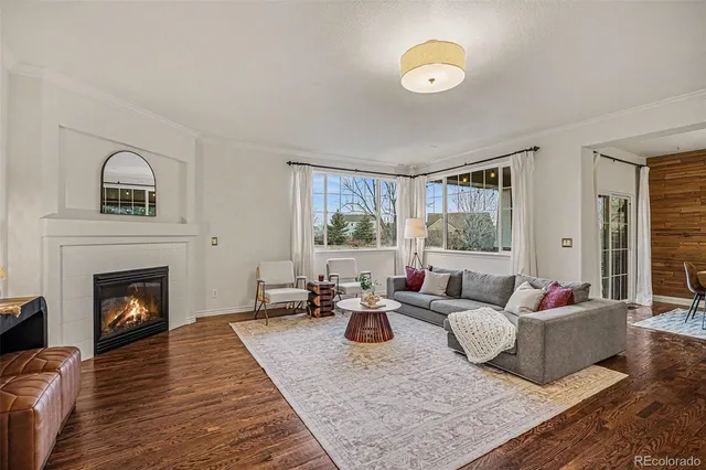 a living room with furniture fireplace and window