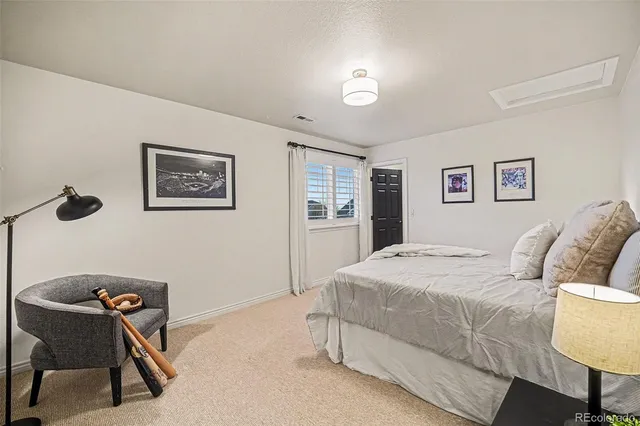 a bedroom with a bed and a table in it