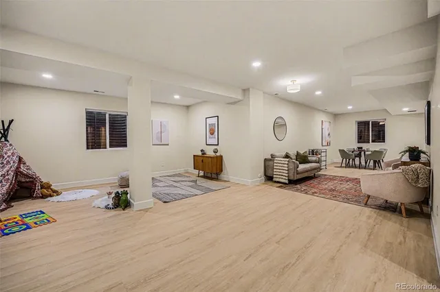 a living room with furniture and a table