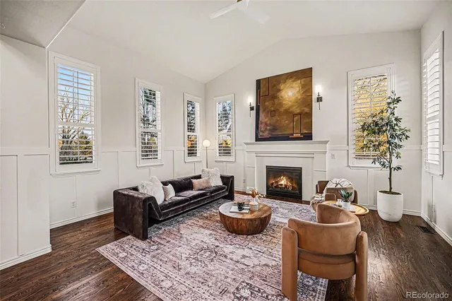 a living room with furniture fireplace and window