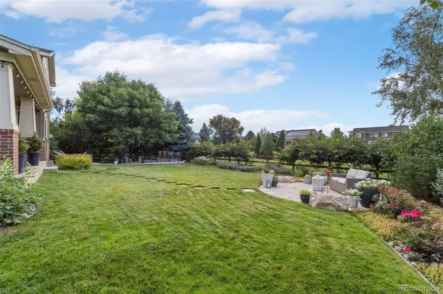 a view of a garden with a lake view