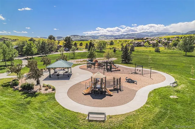 a view of a swimming pool with a table and chairs