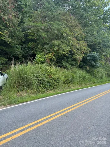 a view of balcony with green space