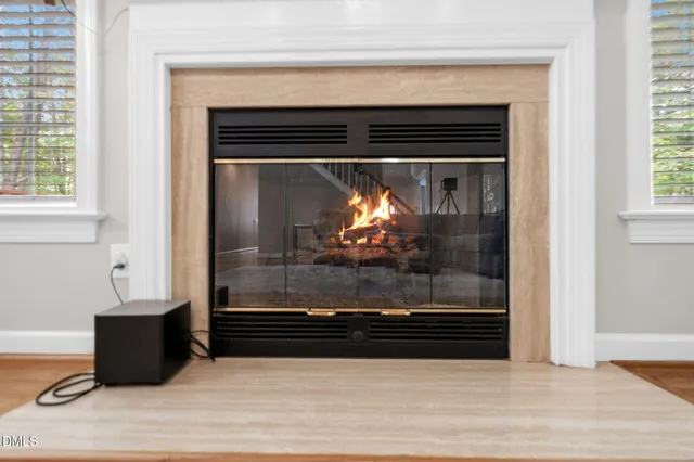 a kitchen with cabinets a sink and chairs in it