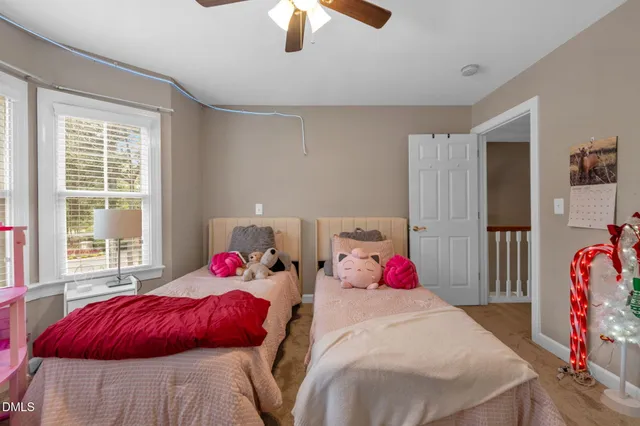 a bedroom with bed and a window