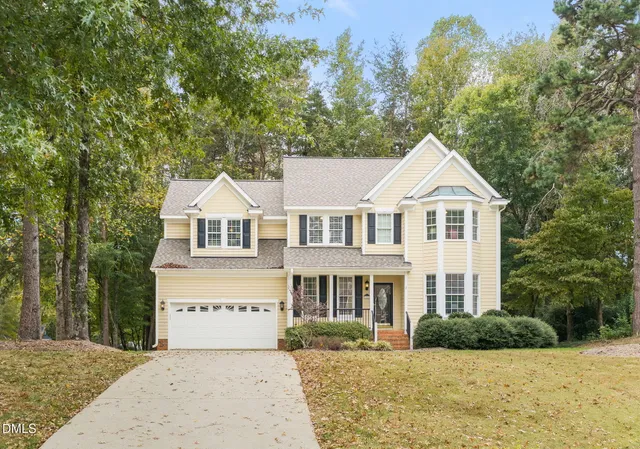 a view of a city with lush green forest