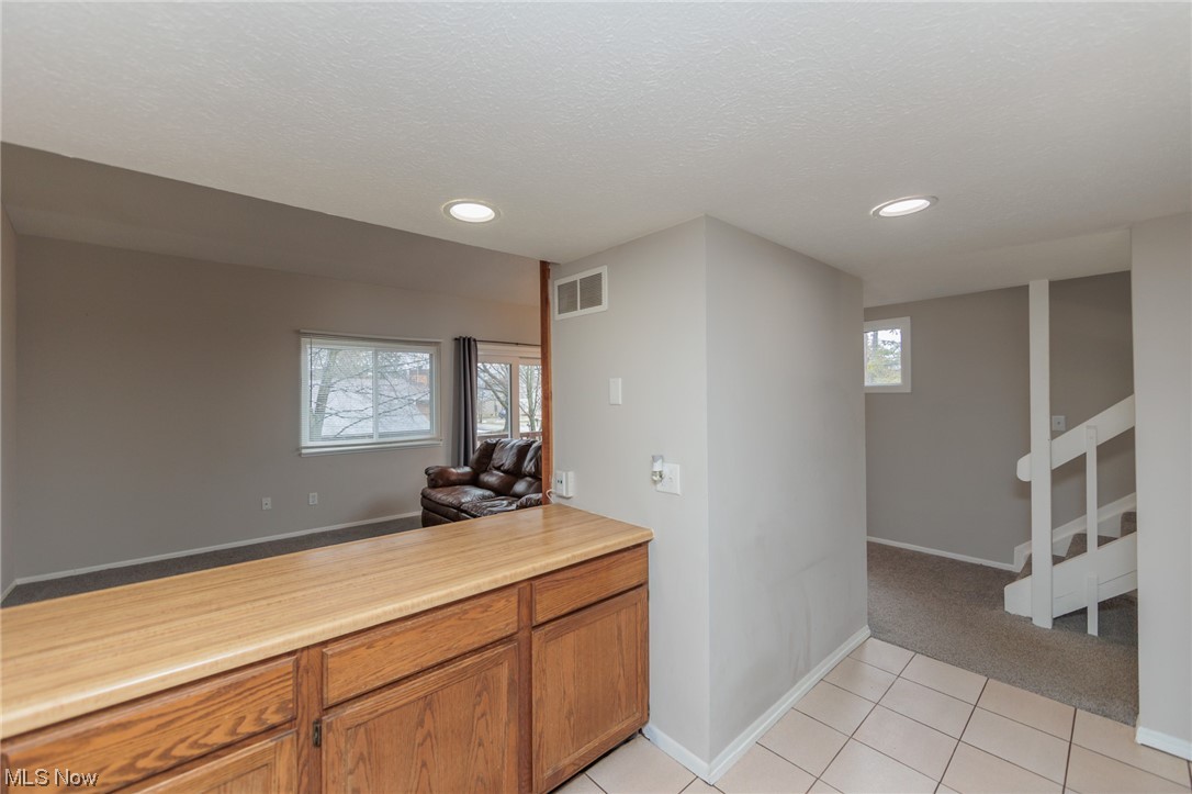 2406 Call Road Stow, OH 44224 - Photo 12 of 30 Kitchen featuring a textured ceiling and light colored carpet