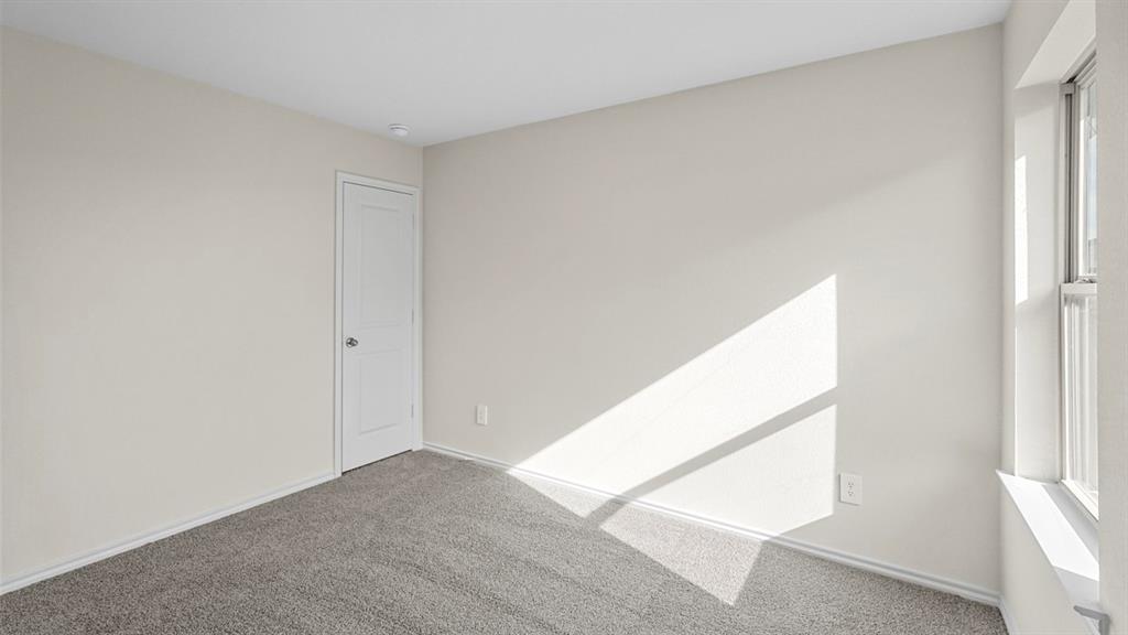 1953 Freeman Street Tyler, TX 75704 - Photo 30 of 32 Neutral-toned room featuring a single window and recessed lighting