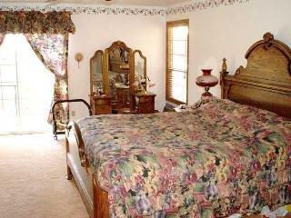 425 Sierra Vista Road Santa Rosa, CA 95401 - Photo 6 of 11 a bedroom with a bed and a dresser next to a window
