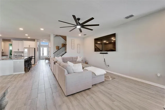 a view of walk in closet with clothes