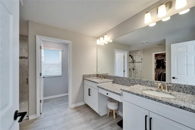 a view of wooden floor and windows in a kitchen