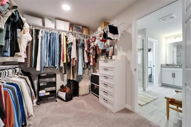 a room with a bed and large window